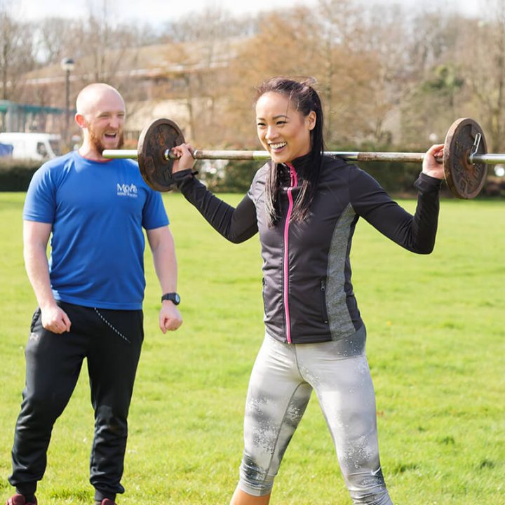 woman lifting a barbell