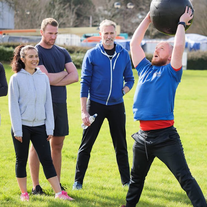 man exercising with a medicine ball