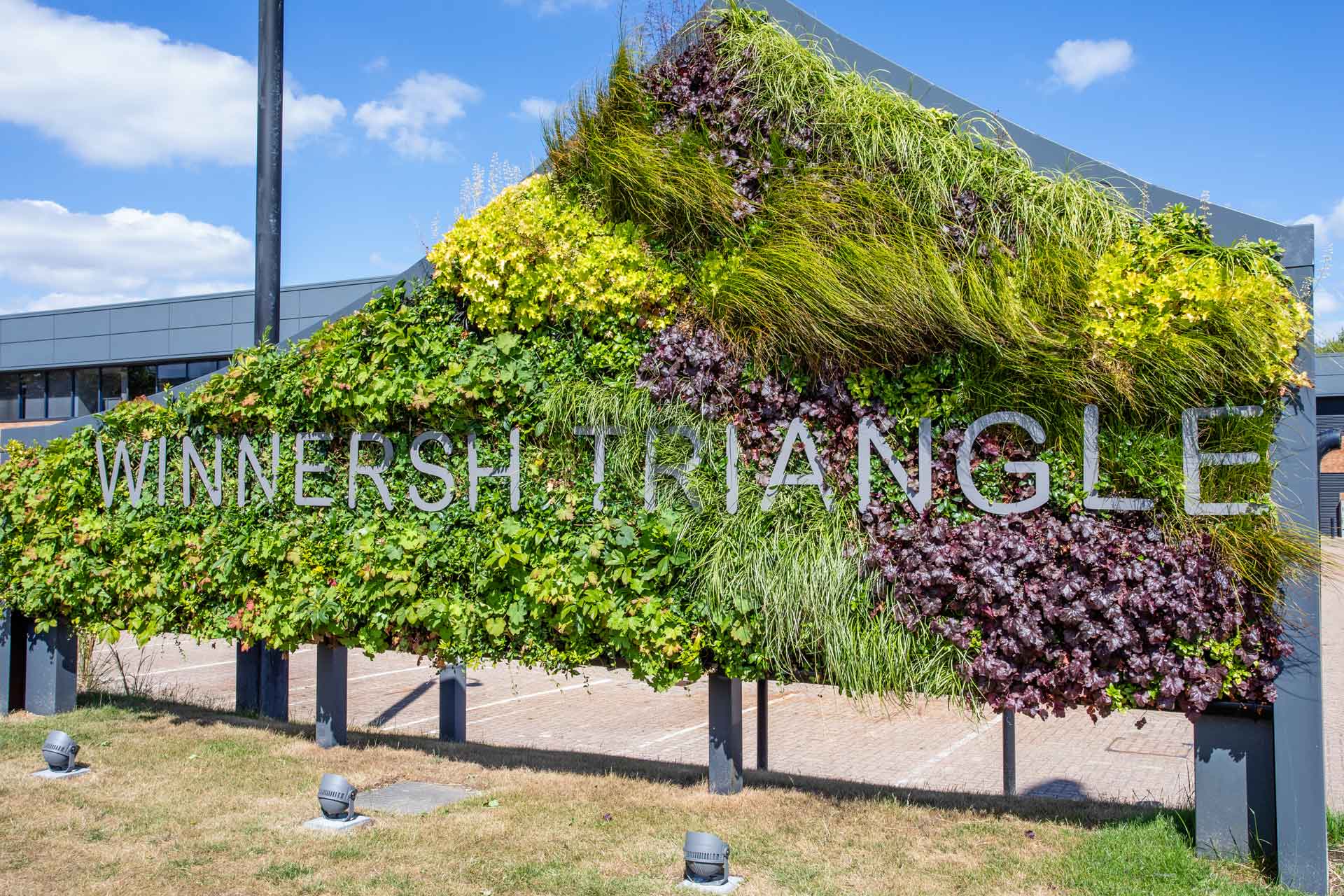 A sign that says winnipeg triangle in front of a building.
