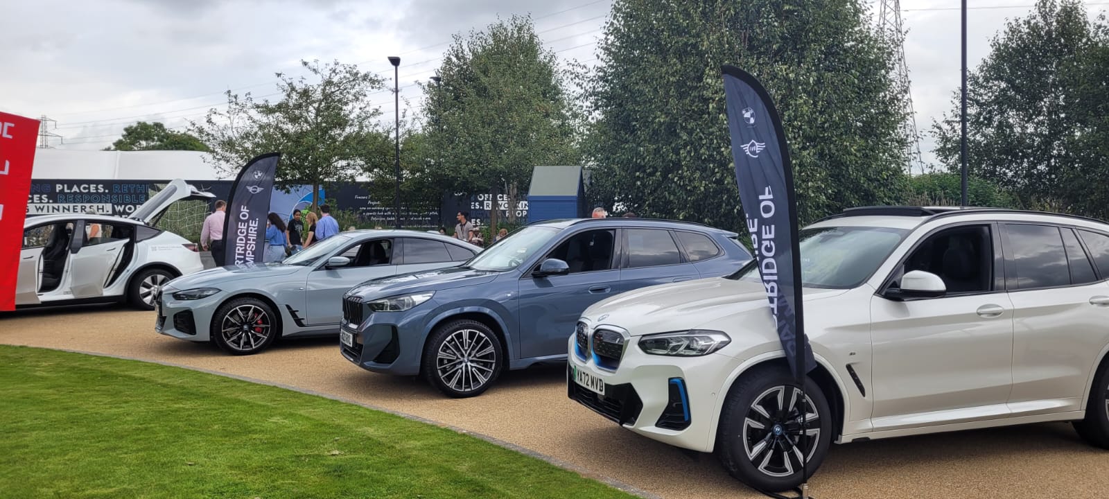Bmw x3 and bmw x5 on display at a car show.