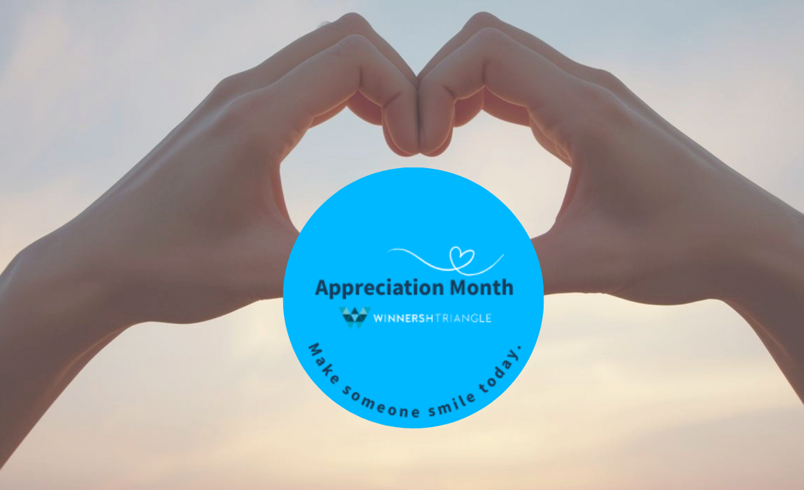 Two hands form a heart shape with